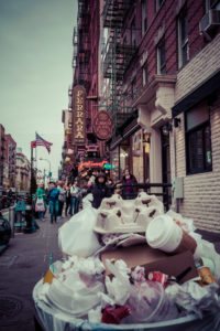 Garbage Dump, Streetview with America Flag and pedestrians in Little Italy, Manhattan, New York, USA Garbage Dump, Streetview with America Flag and pedestrians in Little Italy, Manhattan, New York, USA